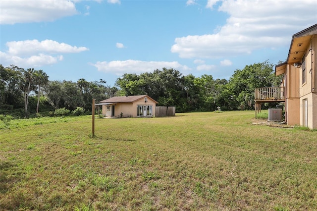 5759 Dogwood Rd, Port Orange, FL 32127 - view of grassy yard with a wooden deck and french doors