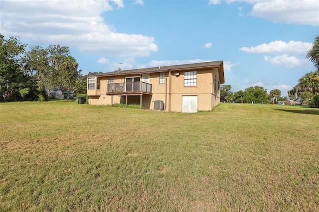 5759 Dogwood Rd, Port Orange, FL 32127 - back of house with a lawn and a wooden deck