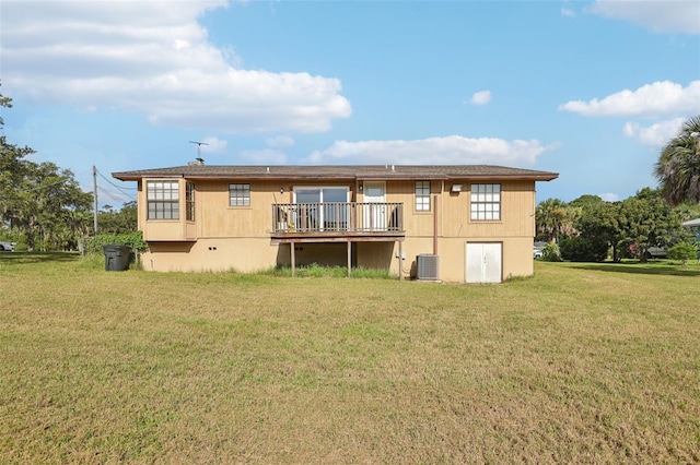 5759 Dogwood Rd, Port Orange, FL 32127 - rear view of property featuring a lawn and a deck