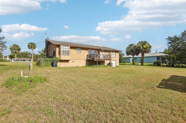 5759 Dogwood Rd, Port Orange, FL 32127 - rear view of property featuring a yard and a wooden deck
