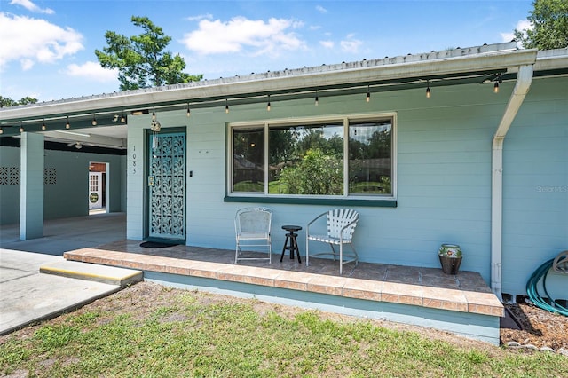 1085 Indigo Rd, Ormond Beach, FL 32174 - rear view of property with a porch