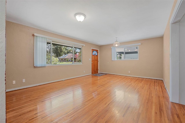 1085 Indigo Rd, Ormond Beach, FL 32174 - empty room with light wood-style floors and baseboards