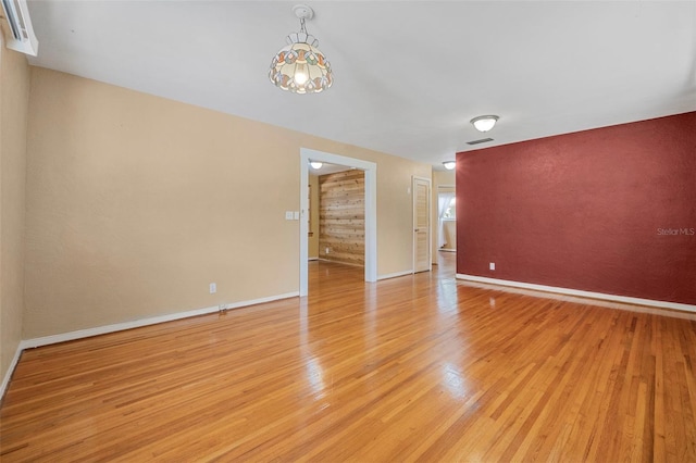 1085 Indigo Rd, Ormond Beach, FL 32174 - empty room with light wood-type flooring and baseboards