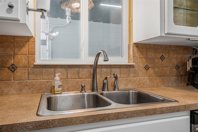 1085 Indigo Rd, Ormond Beach, FL 32174 - kitchen view of white cabinets and tasteful backsplash