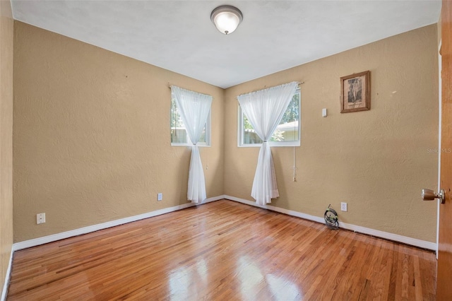 1085 Indigo Rd, Ormond Beach, FL 32174 - empty room featuring wood finished floors and a textured wall