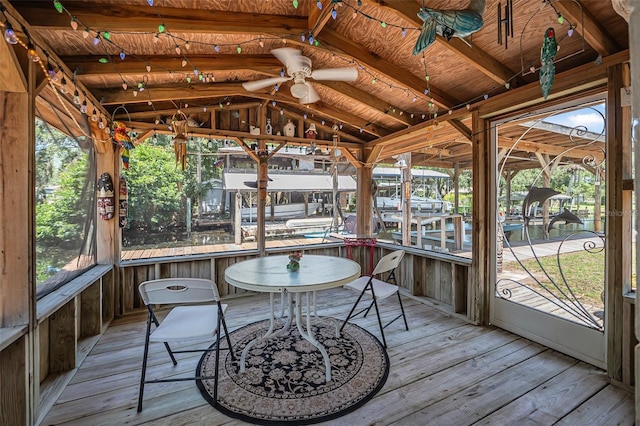 1085 Indigo Rd, Ormond Beach, FL 32174 - unfurnished sunroom with vaulted ceiling and a ceiling fan
