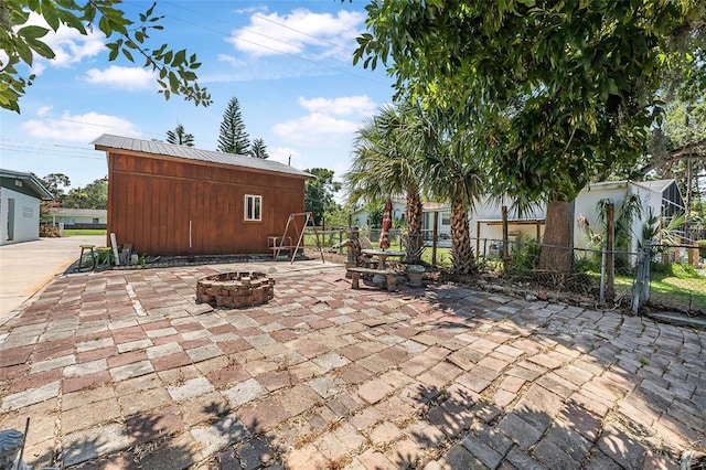 1085 Indigo Rd, Ormond Beach, FL 32174 - view of patio with an outdoor fire pit