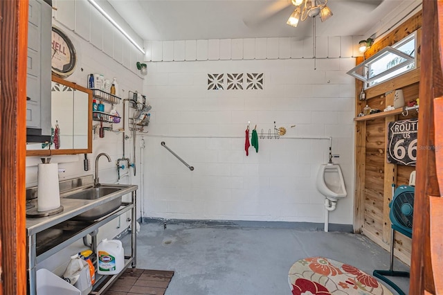1085 Indigo Rd, Ormond Beach, FL 32174 - garage with a sink and ceiling fan