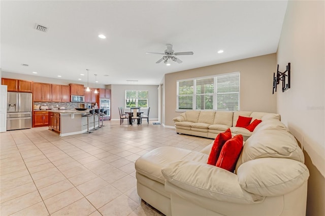 32 Abacus Ave, Ormond Beach, FL 32174 - living area with recessed lighting, light tile patterned floors, and a ceiling fan