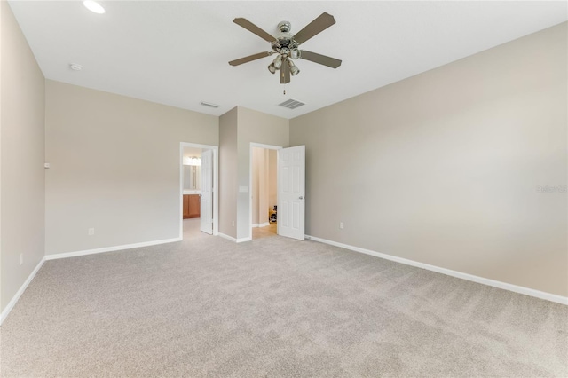 32 Abacus Ave, Ormond Beach, FL 32174 - unfurnished bedroom with light colored carpet, connected bathroom, and ceiling fan