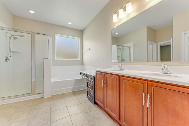 32 Abacus Ave, Ormond Beach, FL 32174 - bathroom featuring double vanity, a bath, a stall shower, and tile patterned flooring