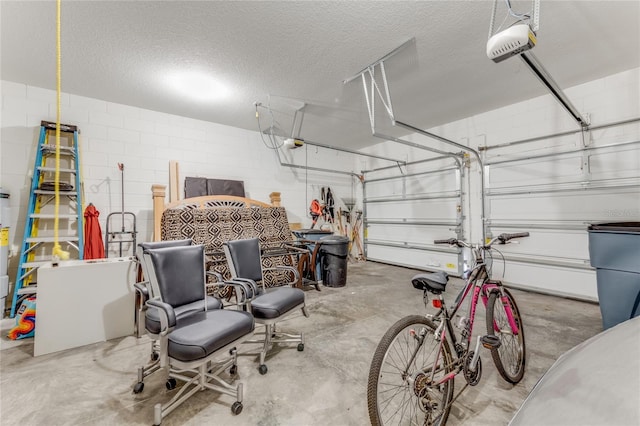 32 Abacus Ave, Ormond Beach, FL 32174 - garage featuring a garage door opener and concrete block wall