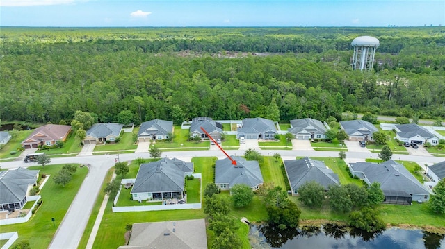 32 Abacus Ave, Ormond Beach, FL 32174 - aerial perspective of suburban area featuring a heavily wooded area and a nearby body of water