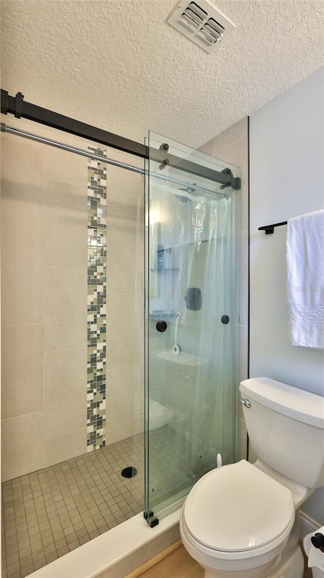 2970 Lantern Dr, South Daytona, FL 32119 - bathroom with a textured ceiling and a stall shower