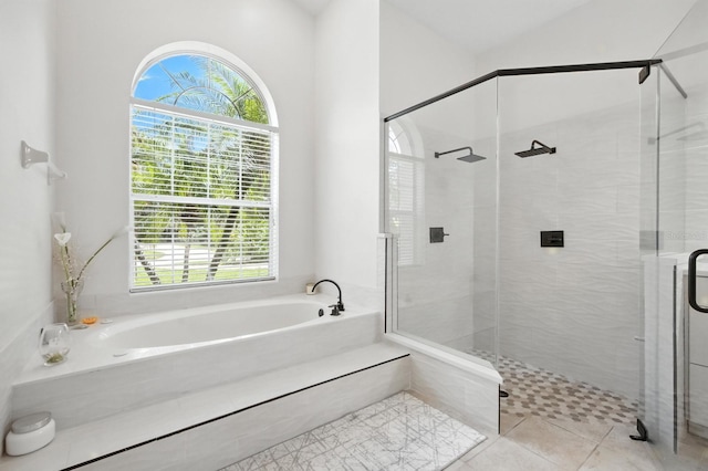 19 Tomoka Cove Way, Ormond Beach, FL 32174 - full bathroom featuring a bath, a stall shower, and tile patterned flooring