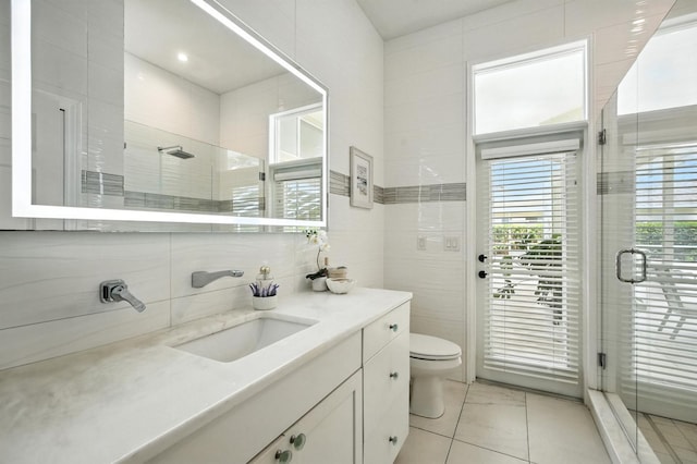 19 Tomoka Cove Way, Ormond Beach, FL 32174 - bathroom featuring tile walls, a stall shower, and vanity