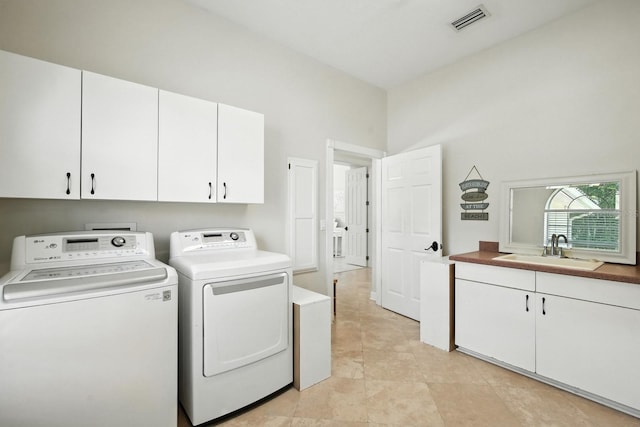 19 Tomoka Cove Way, Ormond Beach, FL 32174 - laundry room with cabinet space and independent washer and dryer