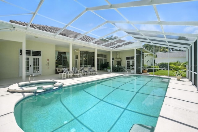 19 Tomoka Cove Way, Ormond Beach, FL 32174 - view of swimming pool featuring french doors, a patio area, a pool with connected hot tub, and a lanai