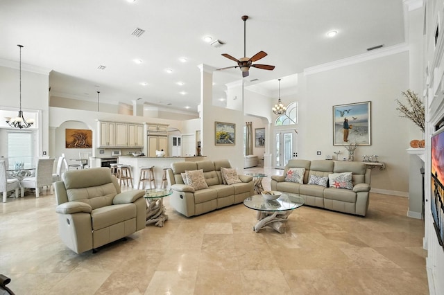19 Tomoka Cove Way, Ormond Beach, FL 32174 - living area with crown molding, a high ceiling, a ceiling fan, a chandelier, and healthy amount of natural light