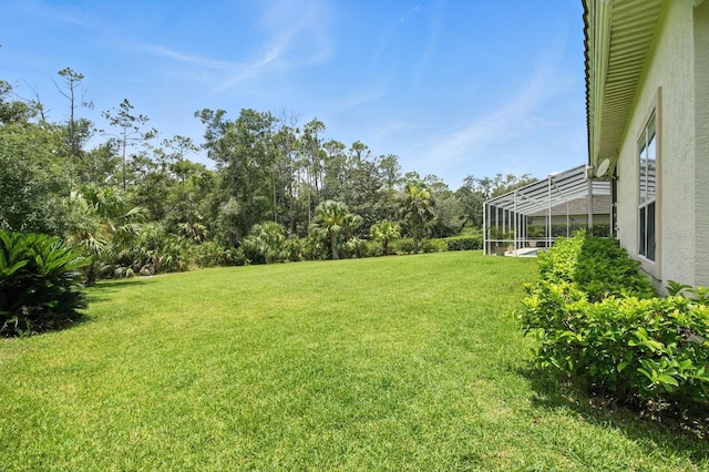 19 Tomoka Cove Way, Ormond Beach, FL 32174 - view of grassy yard with a lanai