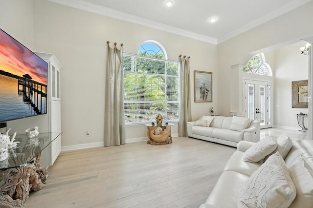 19 Tomoka Cove Way, Ormond Beach, FL 32174 - living room featuring healthy amount of natural light, ornamental molding, wood finished floors, french doors, and recessed lighting