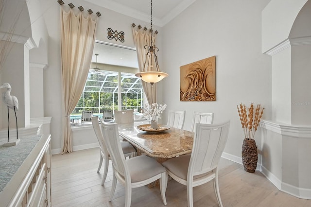 19 Tomoka Cove Way, Ormond Beach, FL 32174 - dining room with light wood-type flooring, ornate columns, and ornamental molding