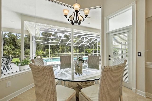 19 Tomoka Cove Way, Ormond Beach, FL 32174 - dining room with a sunroom, a chandelier, and tile patterned floors