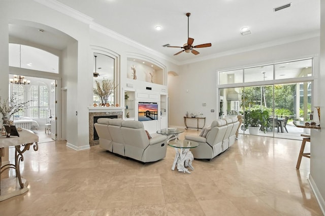 19 Tomoka Cove Way, Ormond Beach, FL 32174 - living room featuring a glass covered fireplace, a ceiling fan, crown molding, a chandelier, and recessed lighting