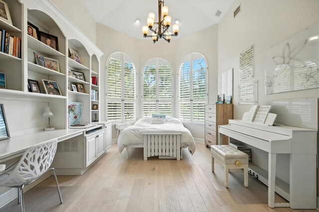 19 Tomoka Cove Way, Ormond Beach, FL 32174 - bedroom with a chandelier and light wood-style floors