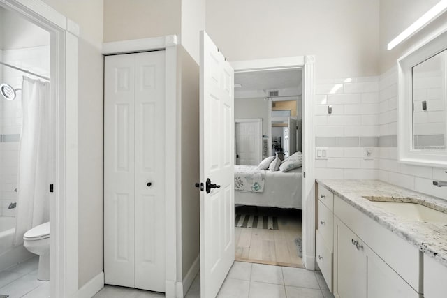 19 Tomoka Cove Way, Ormond Beach, FL 32174 - full bath with a closet, vanity, tile patterned floors, and shower / bath combo with shower curtain