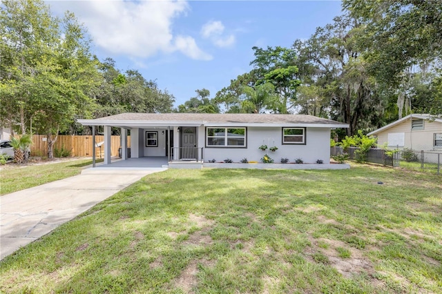 173 Cedar Ave, Orange City, FL 32763 - ranch-style house with an attached carport, driveway, and stucco siding