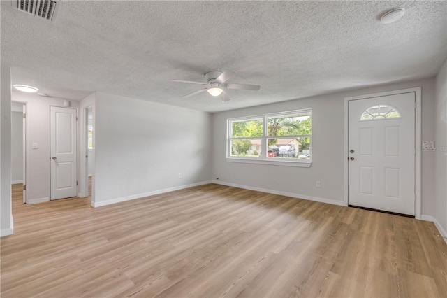 173 Cedar Ave, Orange City, FL 32763 - entryway with a ceiling fan, light wood finished floors, and a textured ceiling
