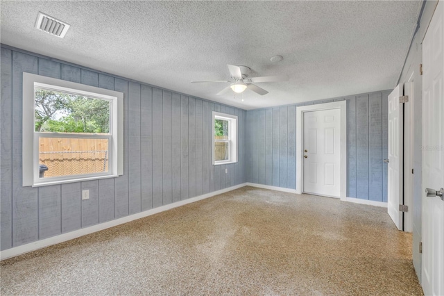 173 Cedar Ave, Orange City, FL 32763 - spare room featuring a ceiling fan and a textured ceiling