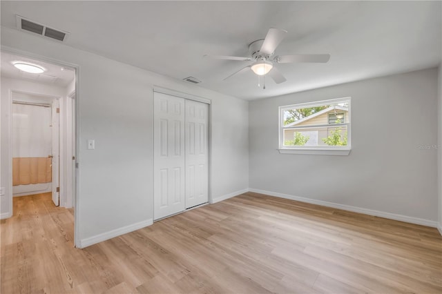 173 Cedar Ave, Orange City, FL 32763 - unfurnished bedroom featuring light wood-style floors, a closet, and ceiling fan