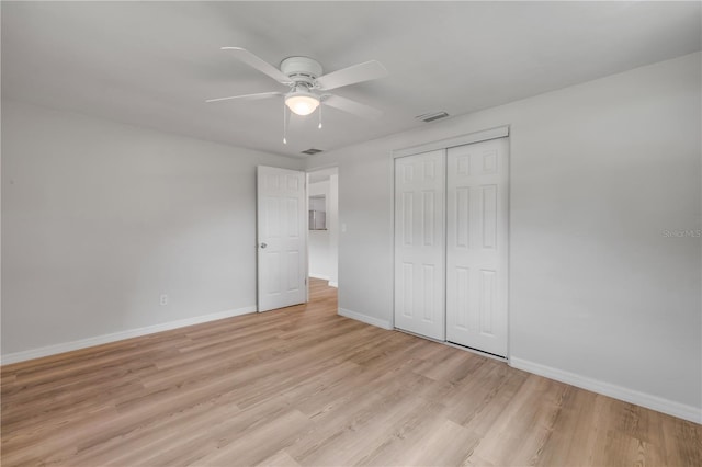 173 Cedar Ave, Orange City, FL 32763 - unfurnished bedroom featuring a closet, light wood finished floors, and a ceiling fan