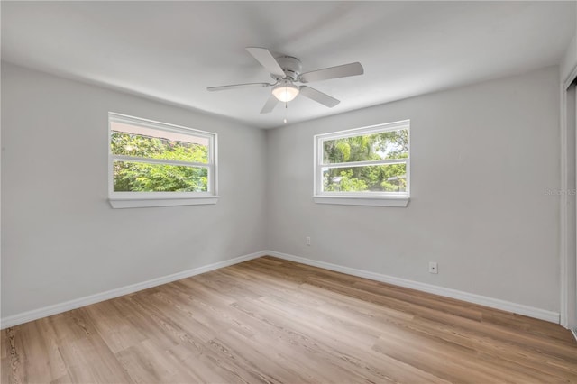 173 Cedar Ave, Orange City, FL 32763 - unfurnished room featuring plenty of natural light, a ceiling fan, and light wood-style flooring