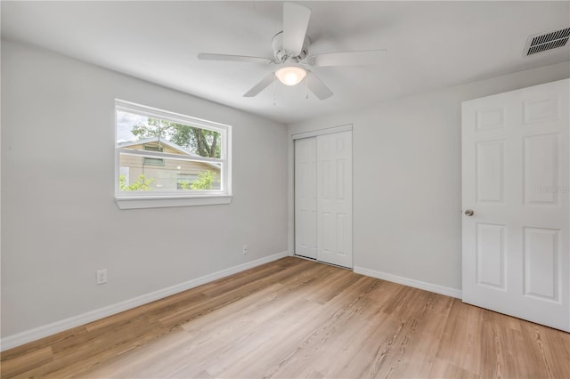 173 Cedar Ave, Orange City, FL 32763 - unfurnished bedroom with light wood-style flooring, a closet, and ceiling fan