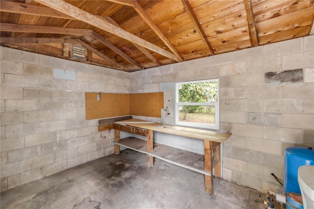 173 Cedar Ave, Orange City, FL 32763 - misc room with a workshop area, lofted ceiling, unfinished concrete flooring, wood ceiling, and concrete block wall