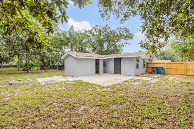 173 Cedar Ave, Orange City, FL 32763 - back of house featuring a fenced backyard and a patio area