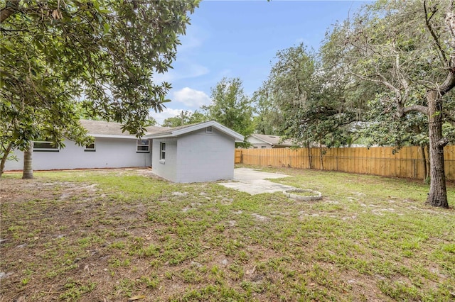 173 Cedar Ave, Orange City, FL 32763 - fenced backyard featuring a patio
