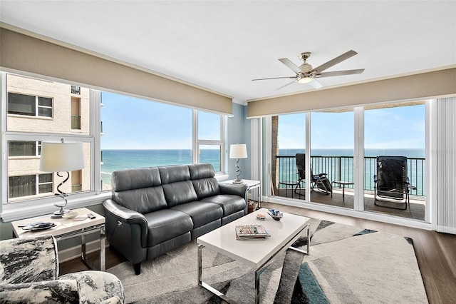 3315 S Atlantic Ave Unit 1605, Daytona Beach Shores, FL 32118 - living area featuring wood finished floors, ceiling fan, and a water view