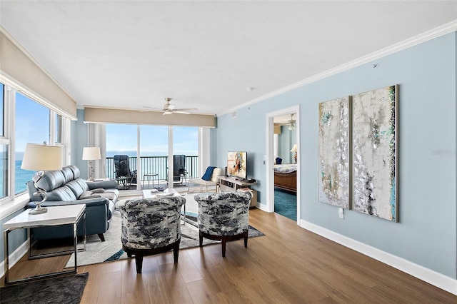 3315 S Atlantic Ave Unit 1605, Daytona Beach Shores, FL 32118 - living area featuring wood finished floors, crown molding, and a ceiling fan