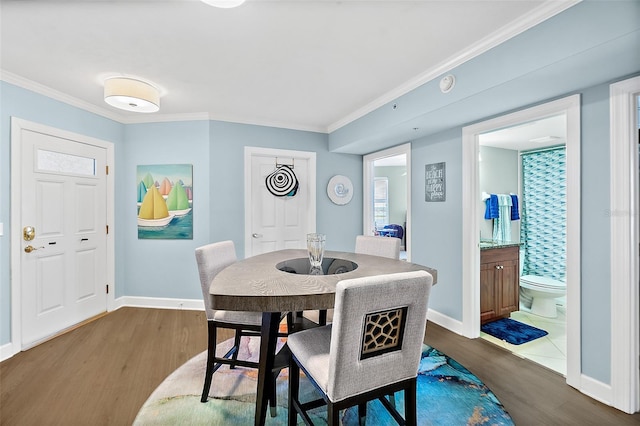 3315 S Atlantic Ave Unit 1605, Daytona Beach Shores, FL 32118 - dining space with dark wood-style floors and ornamental molding