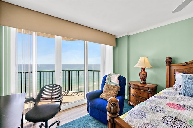 3315 S Atlantic Ave Unit 1605, Daytona Beach Shores, FL 32118 - bedroom featuring a water view, access to outside, wood finished floors, and crown molding