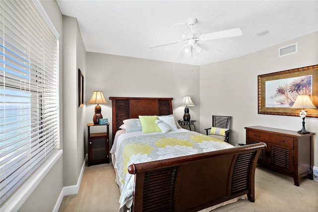 3315 S Atlantic Ave Unit 1605, Daytona Beach Shores, FL 32118 - bedroom with light carpet and a ceiling fan