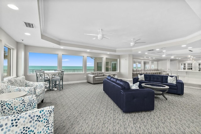 3315 S Atlantic Ave Unit 1605, Daytona Beach Shores, FL 32118 - living area with a tray ceiling, carpet, crown molding, recessed lighting, and a ceiling fan