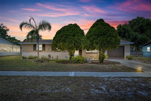 2468 Kimberly Dr, Deltona, FL 32738 - view of front facade featuring driveway, a lawn, and an attached garage