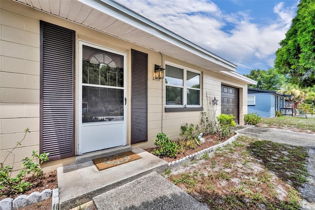 2468 Kimberly Dr, Deltona, FL 32738 - view of exterior entry featuring a garage