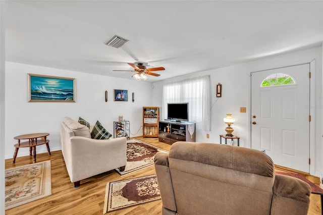 2468 Kimberly Dr, Deltona, FL 32738 - living room with plenty of natural light, light wood finished floors, and ceiling fan