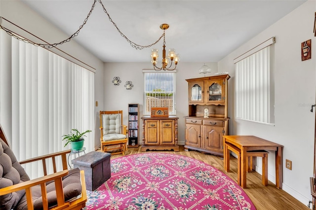 2468 Kimberly Dr, Deltona, FL 32738 - living area featuring light wood-type flooring and a chandelier